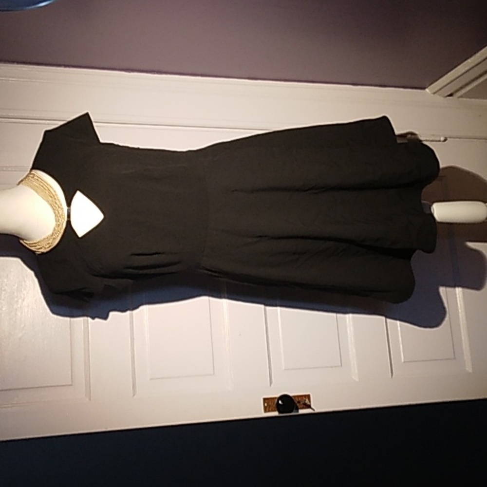 Sexy Little Black dress.  Aa Studio . short sleeve peekaboo neckline knee length